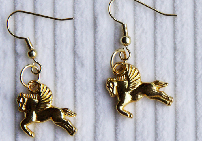 Golden horse earrings home