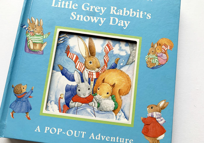 Little grey rabbits snowy day homepage